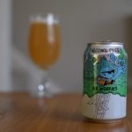 Can of Lervig No Worries non-alcoholic beer with glass in background