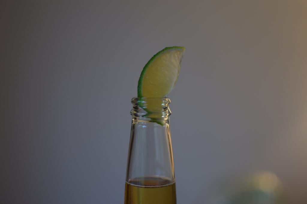 Close up of a slice of lime in a bottle of Corona Cero